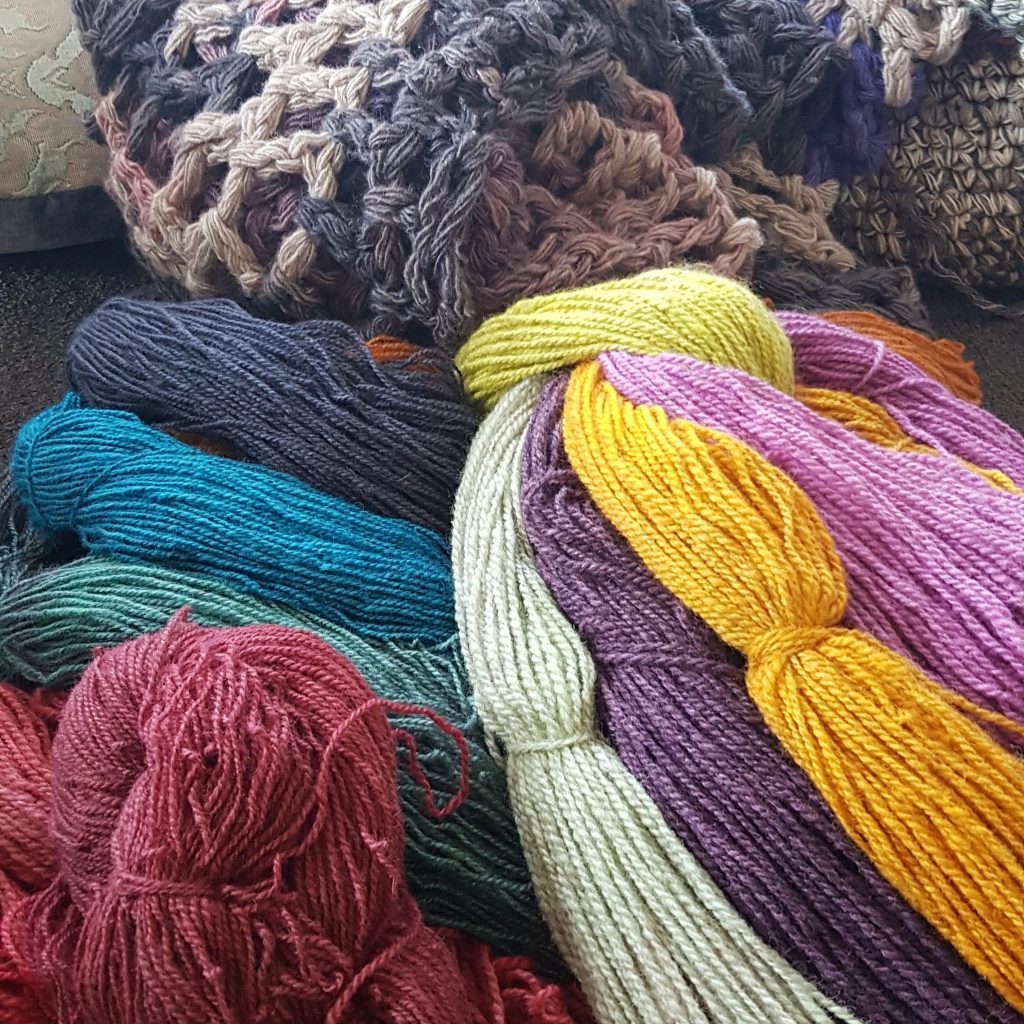 multi coloured balls of woven wool