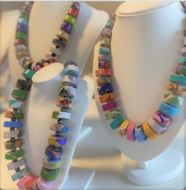 multi-coloured necklaces showcased on manequins