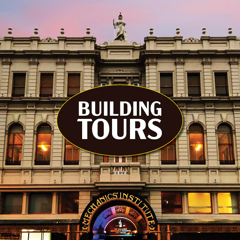 Historic building with Building Tours sign at twilight