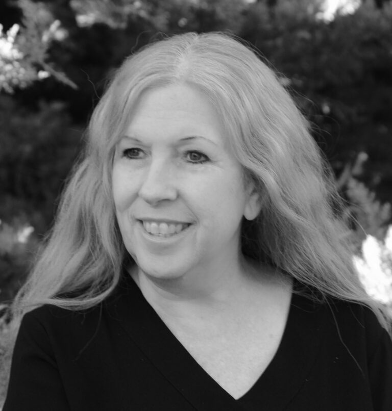 Smiling blonde woman in black and white portrait