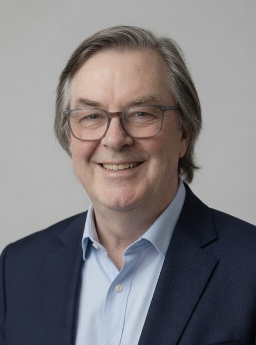 Smiling middle-aged man with glasses in professional attire