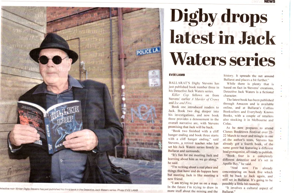Author Digby Stevens holds Killer Cop book in laneway