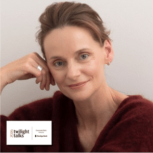 Woman smiling softly in burgundy jumper for Twilight Talks 2026