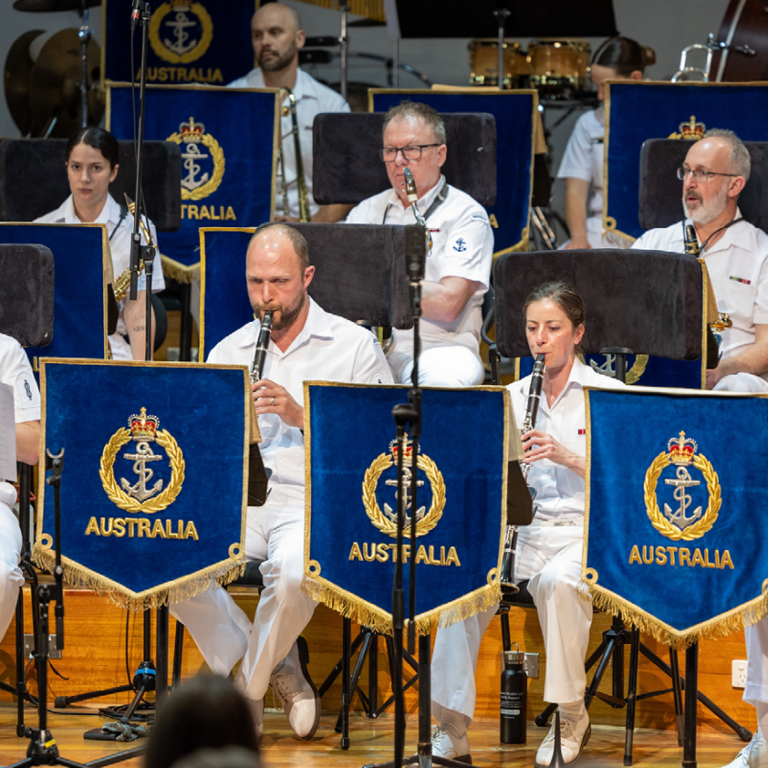 Royal Australian Navy Band performing with clarinets on stage