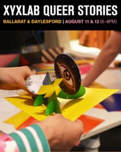 Hands holding colourful pop-up paper craft at XYXLAB event