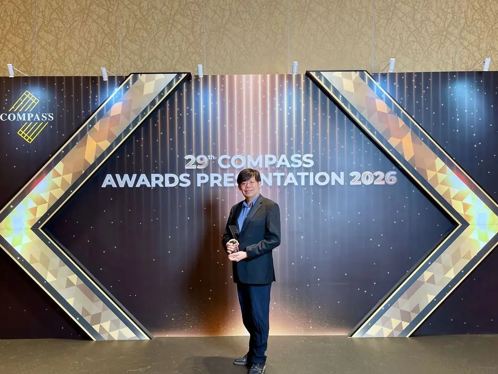 Man holding award at 29th COMPASS Awards Presentation 2026